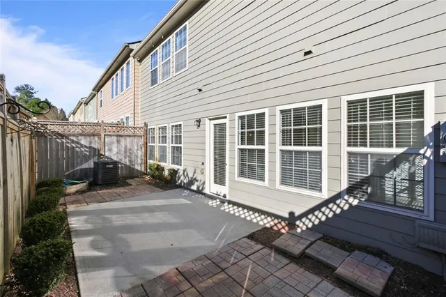 a view of a house with backyard and wooden roof