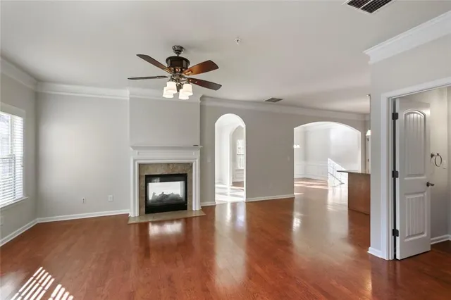 a view of a livingroom with a fireplace and wooden floor