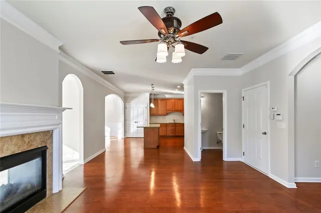 a view of an empty room fire place and a fireplace
