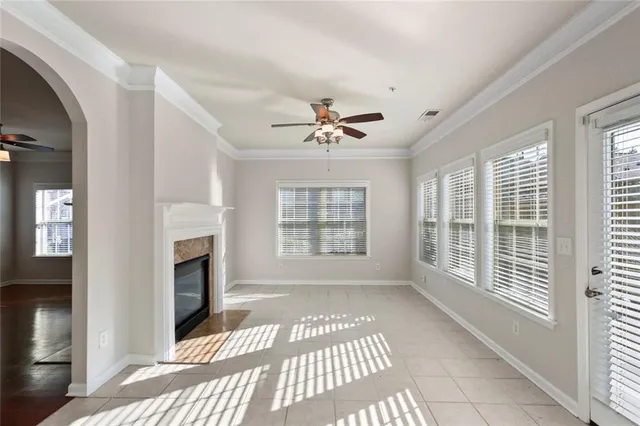 a view of an empty room with a fireplace