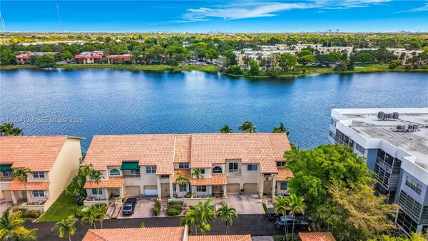 an aerial view of residential building and lake