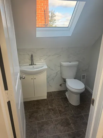 a bathroom with a toilet and a sink