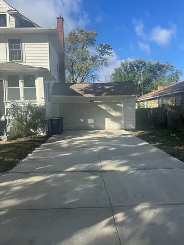 a view of a house with a yard next to a road