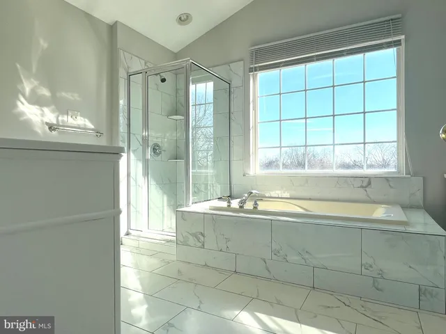 a bathroom with a bathtub and a sink