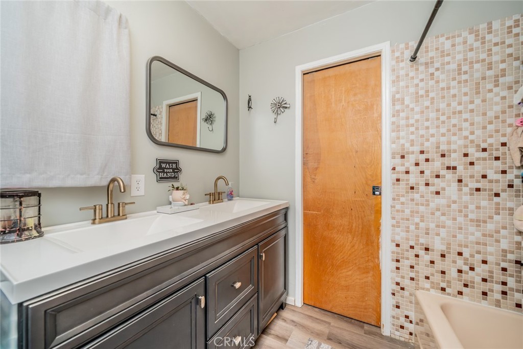 52647 Pine Cove Road Idyllwild, CA 92549 - Photo 5 of 35 a bathroom with a sink a mirror and a shower