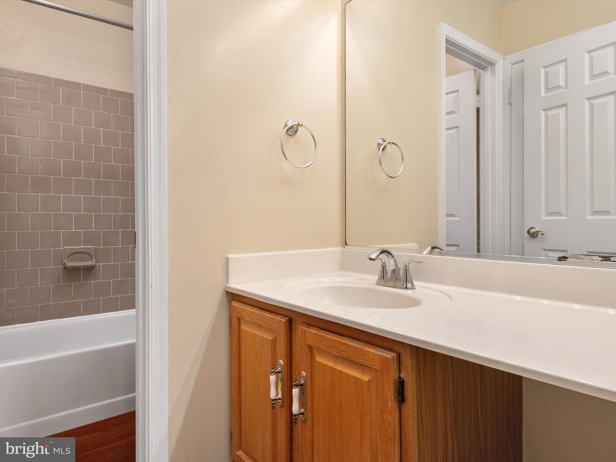 14226 Greenview Drive Laurel, MD 20708 - Photo 29 of 46 a bathroom with a sink and a mirror