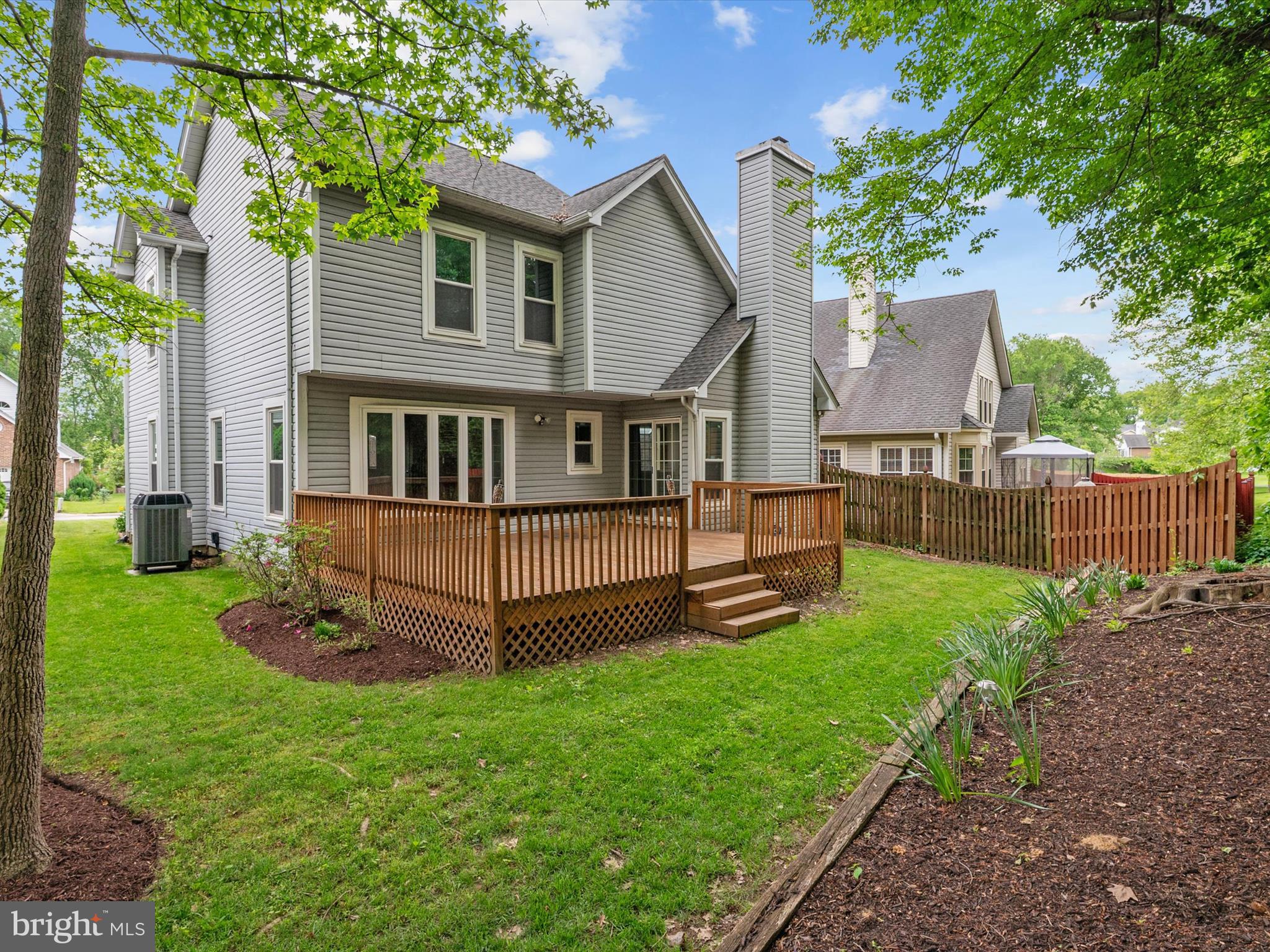 14226 Greenview Drive Laurel, MD 20708 - Photo 40 of 46 a view of a house with a yard and sitting area
