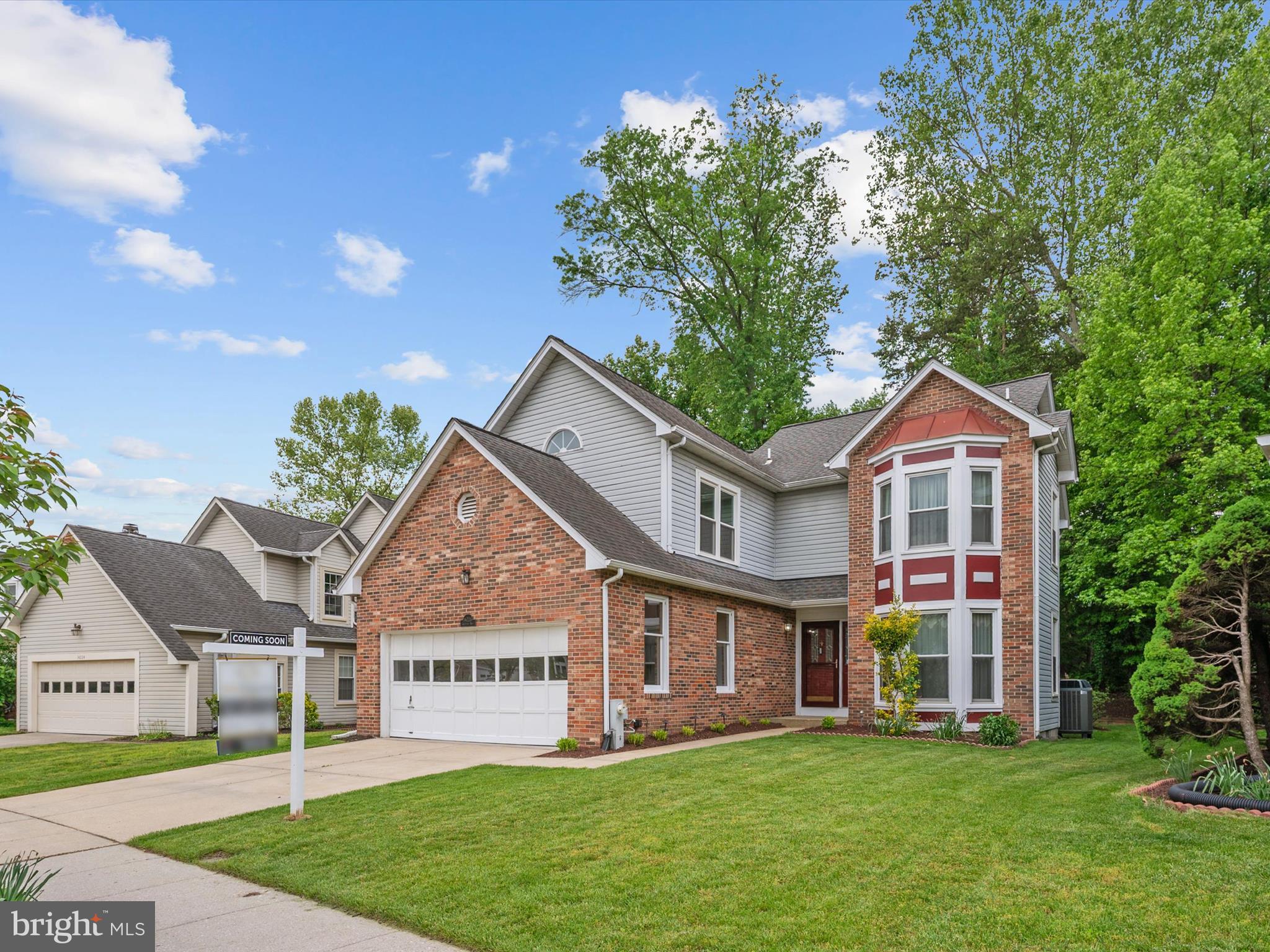 14226 Greenview Drive Laurel, MD 20708 - Photo 4 of 46 a front view of a house with a garden and deck