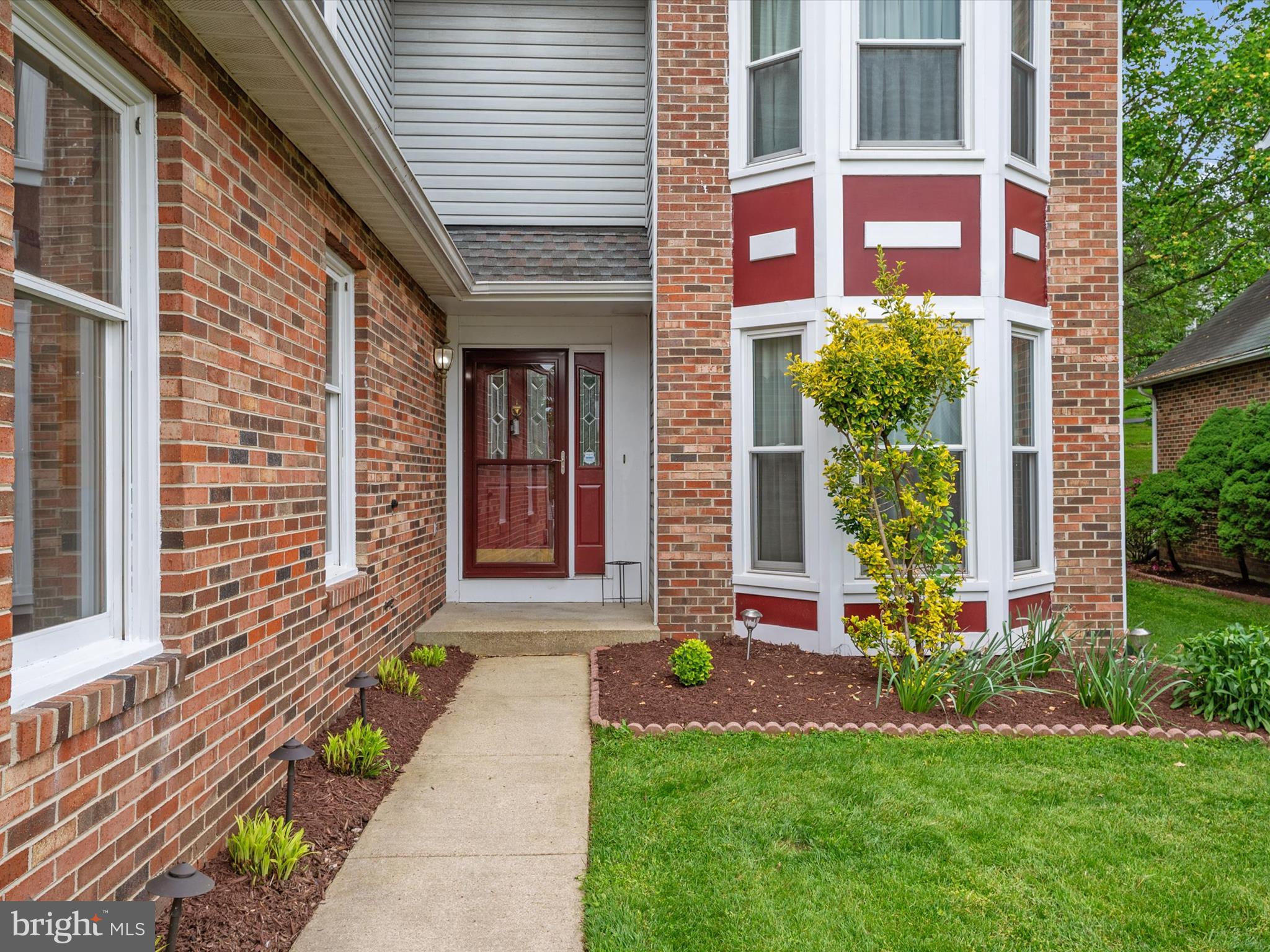 14226 Greenview Drive Laurel, MD 20708 - Photo 5 of 46 a front view of a house with a yard