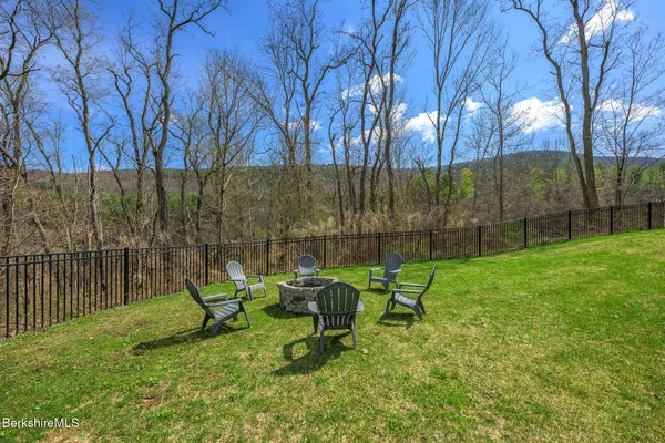 a view of a bench in a backyard