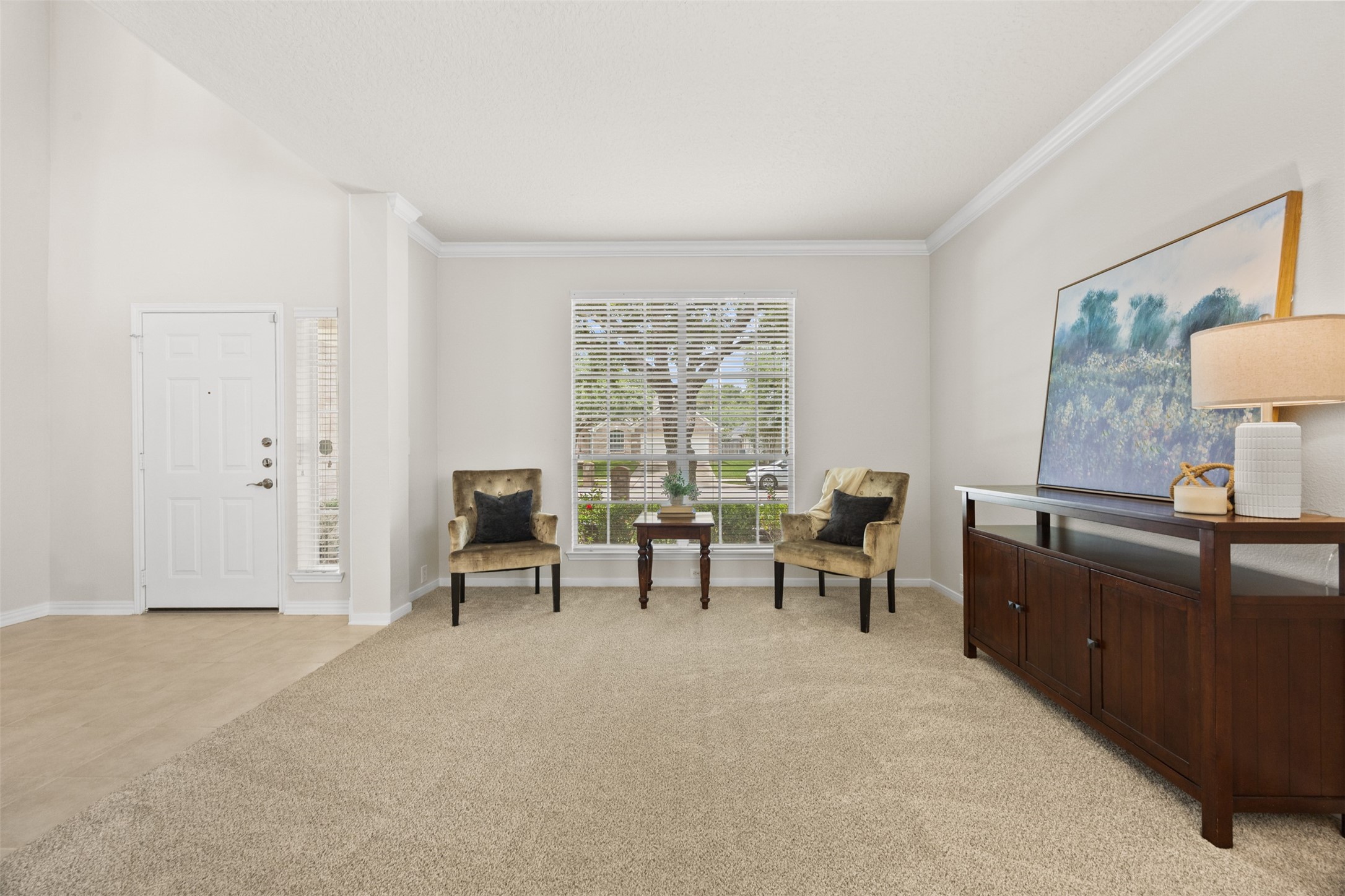 2219 Louetta Brook Lane Spring, TX 77388 - Photo 9 of 34 Versatile front living area with large window, neutral finishes, and flexible space perfect for a sitting room, office, or formal living.