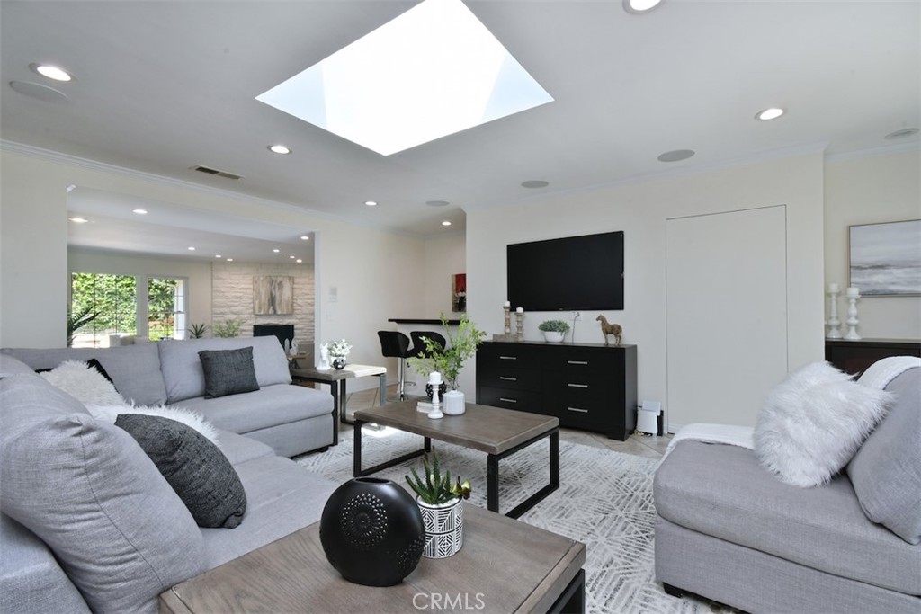 3935 Bon Homme Road Calabasas, CA 91302 - Photo 16 of 64 a living room with furniture and a flat screen tv