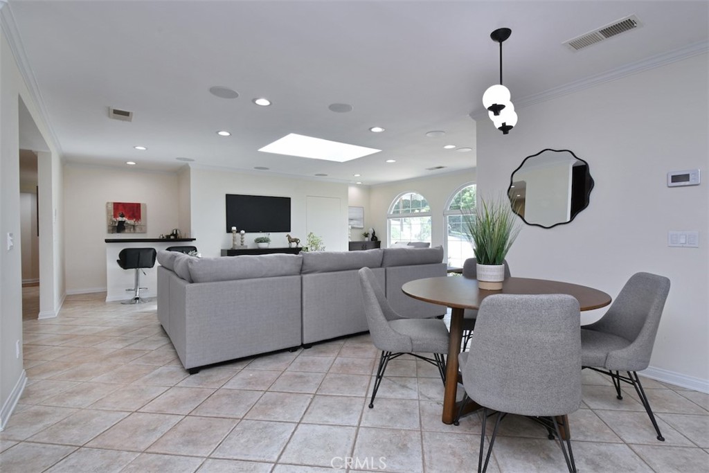 3935 Bon Homme Road Calabasas, CA 91302 - Photo 20 of 64 a living room with furniture kitchen view and a flat screen tv