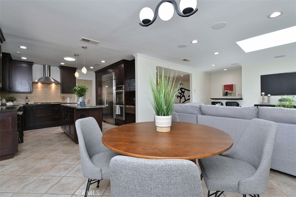 3935 Bon Homme Road Calabasas, CA 91302 - Photo 22 of 64 a dining room with furniture and a kitchen view