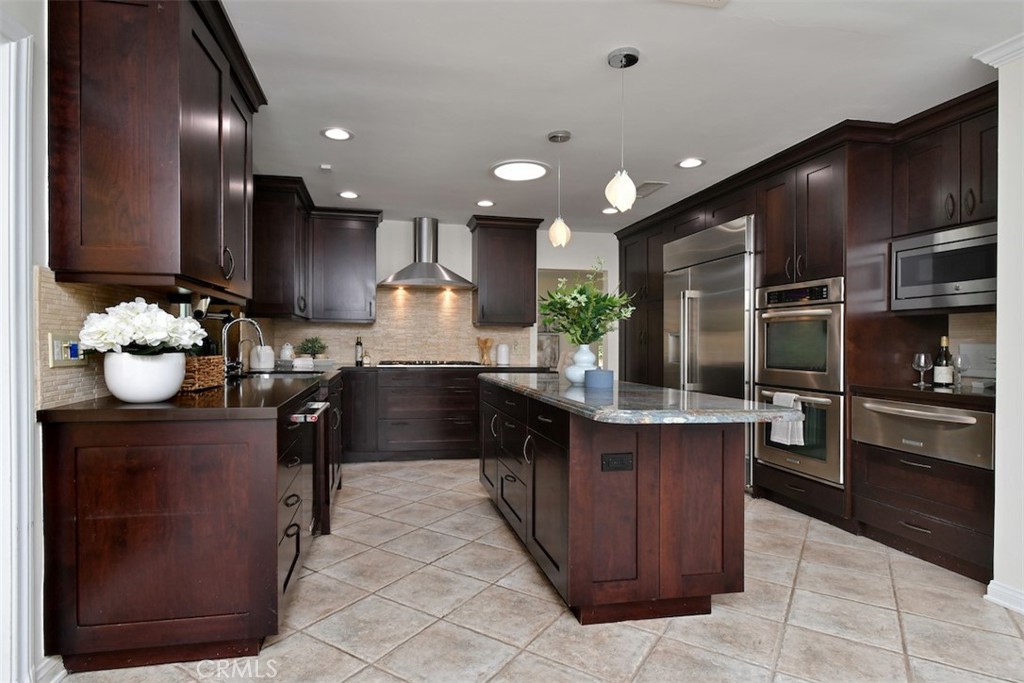 3935 Bon Homme Road Calabasas, CA 91302 - Photo 24 of 64 a kitchen with kitchen island granite countertop lots of counter top space