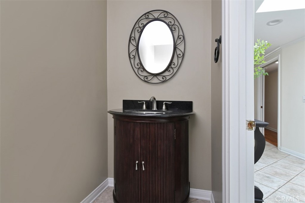 3935 Bon Homme Road Calabasas, CA 91302 - Photo 29 of 64 a bathroom with a sink and a mirror