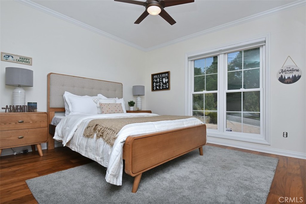 3935 Bon Homme Road Calabasas, CA 91302 - Photo 30 of 64 a spacious bedroom with a bed and glass window