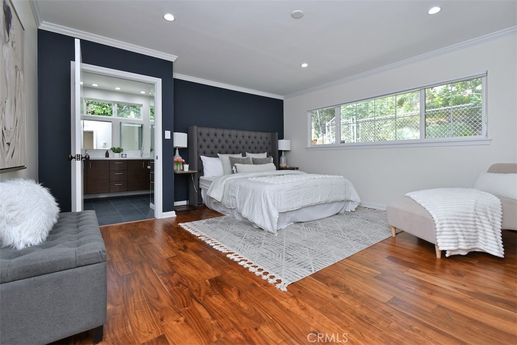 3935 Bon Homme Road Calabasas, CA 91302 - Photo 35 of 64 a bedroom with a large bed and a couch