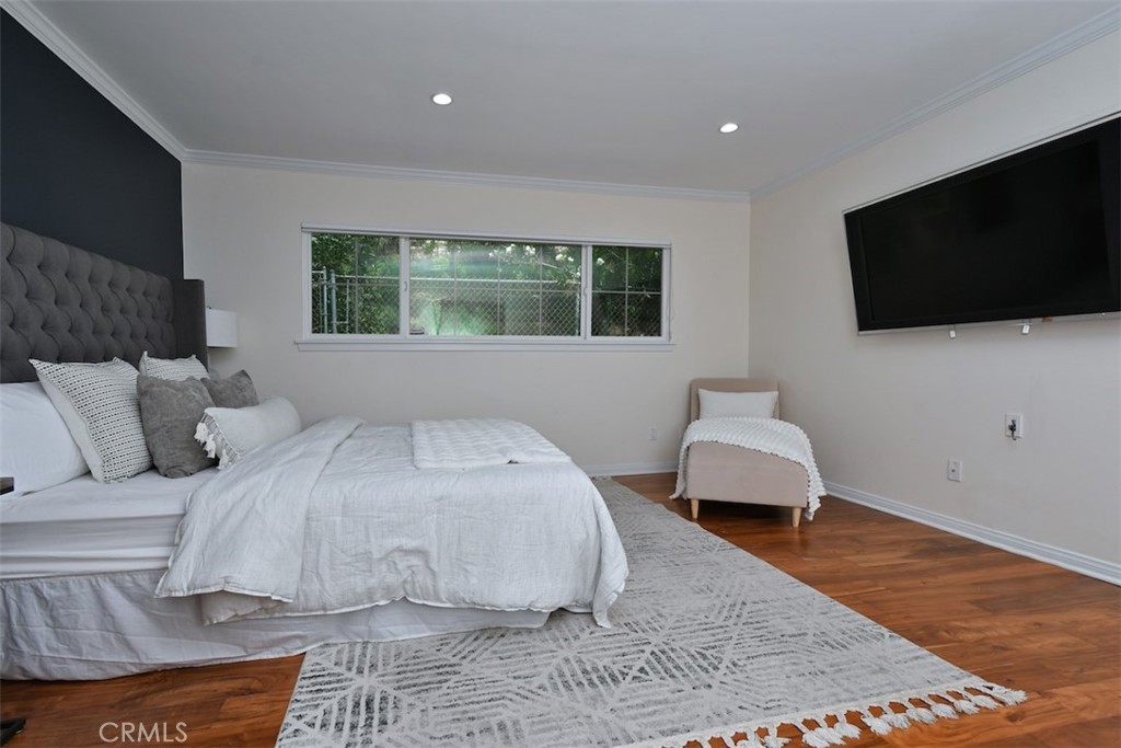 3935 Bon Homme Road Calabasas, CA 91302 - Photo 36 of 64 a bedroom with a bed and a flat screen tv