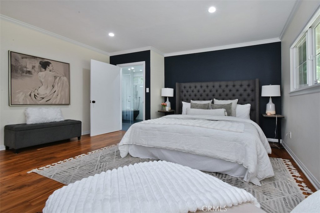 3935 Bon Homme Road Calabasas, CA 91302 - Photo 37 of 64 a bedroom with a large bed and a couch