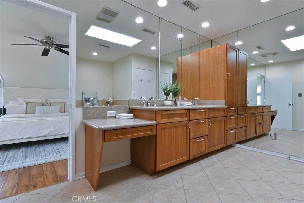 3935 Bon Homme Road Calabasas, CA 91302 - Photo 44 of 64 a bathroom with a sink double vanity and a mirror