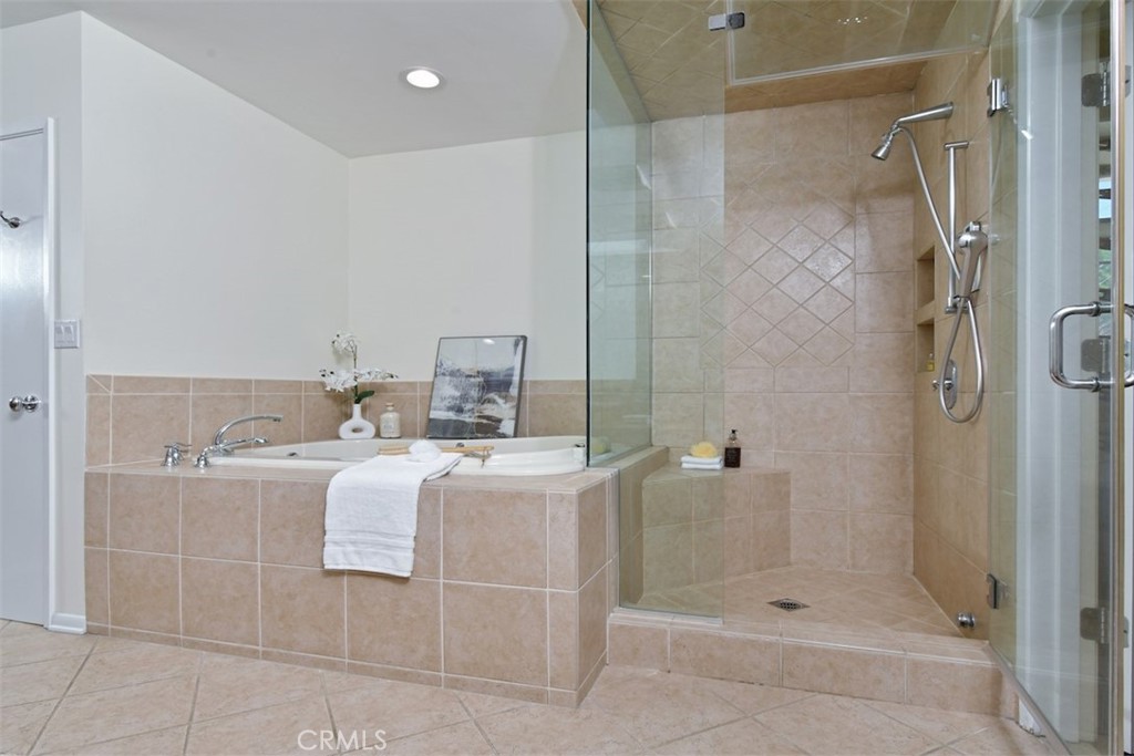 3935 Bon Homme Road Calabasas, CA 91302 - Photo 45 of 64 a bathroom with a shower sink and mirror