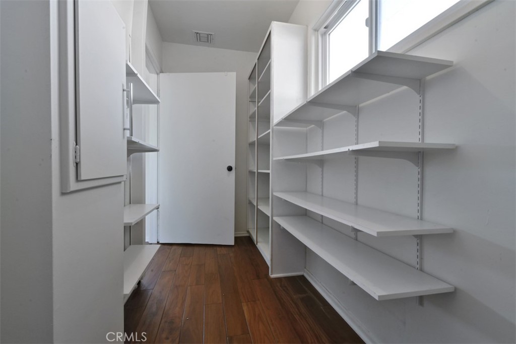 3935 Bon Homme Road Calabasas, CA 91302 - Photo 48 of 64 a view of walk in closet with empty racks