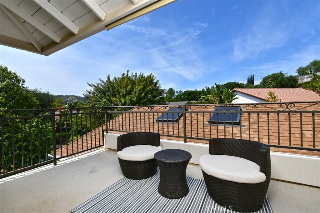 3935 Bon Homme Road Calabasas, CA 91302 - Photo 51 of 64 a view of a balcony with furniture