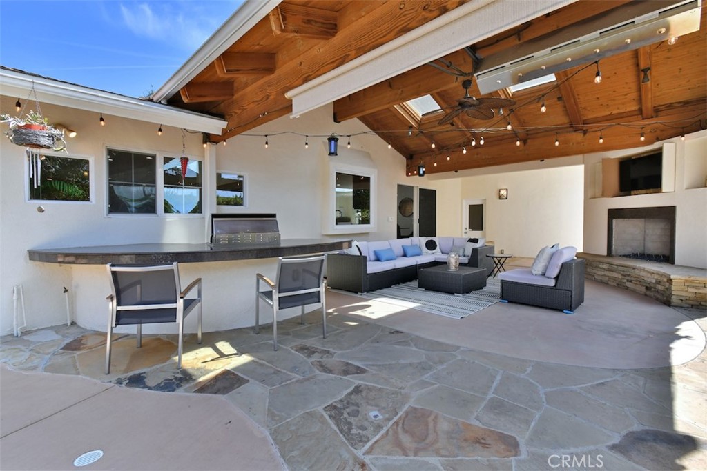 3935 Bon Homme Road Calabasas, CA 91302 - Photo 55 of 64 a living room with furniture and a flat screen tv