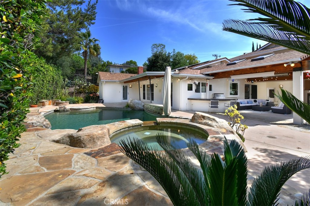 3935 Bon Homme Road Calabasas, CA 91302 - Photo 57 of 64 a view of a house with pool and chairs