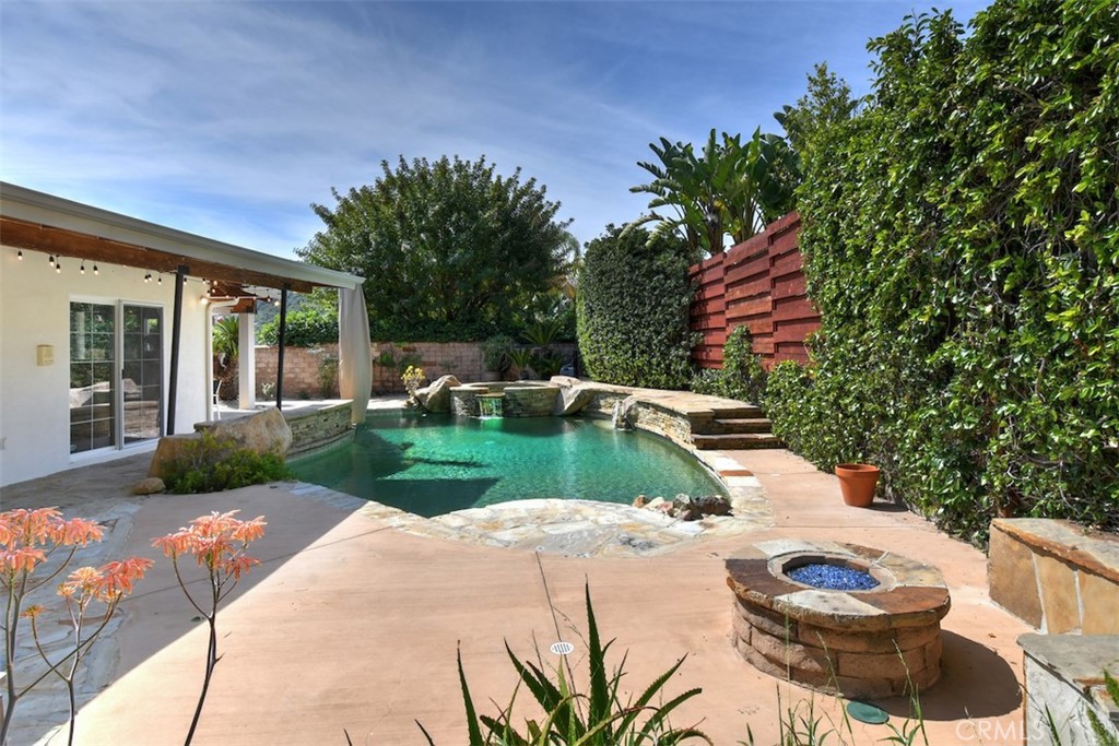 3935 Bon Homme Road Calabasas, CA 91302 - Photo 61 of 64 a backyard of a house with table and chairs