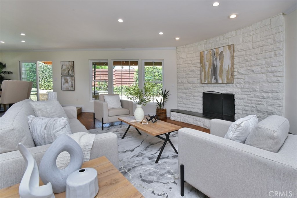 3935 Bon Homme Road Calabasas, CA 91302 - Photo 10 of 64 a living room with furniture and a fireplace