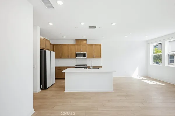 a kitchen that has a sink and a stove