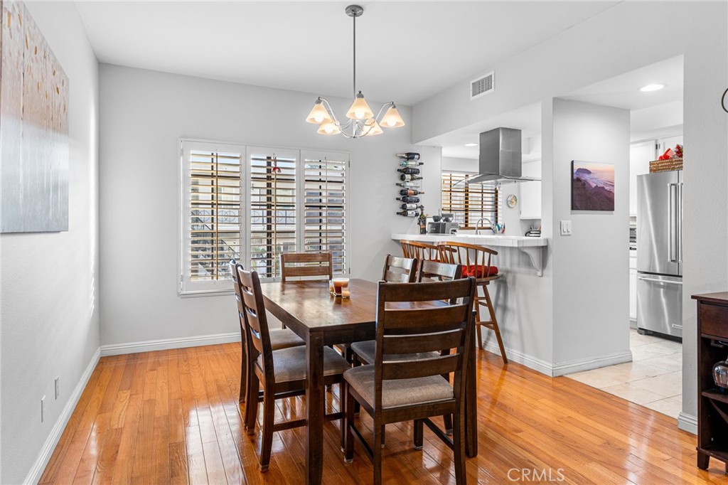 515 South Madison Avenue, Unit 2 Pasadena, CA 91101 - Photo 13 of 35 a view of a dining room with furniture window and wooden floor