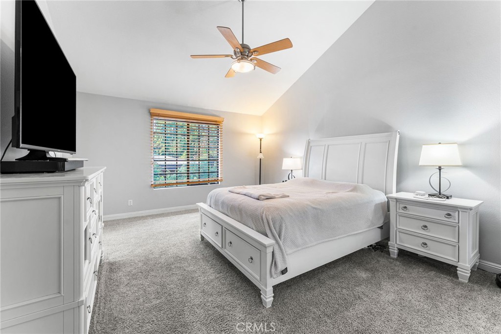 515 South Madison Avenue, Unit 2 Pasadena, CA 91101 - Photo 16 of 35 a spacious bedroom with a bed and a flat screen tv