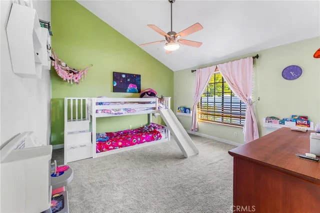a bedroom with furniture and a flat screen tv