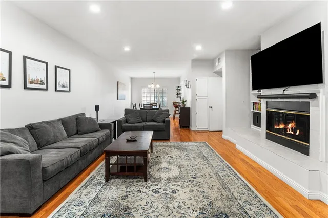 a living room with furniture and a fireplace or television