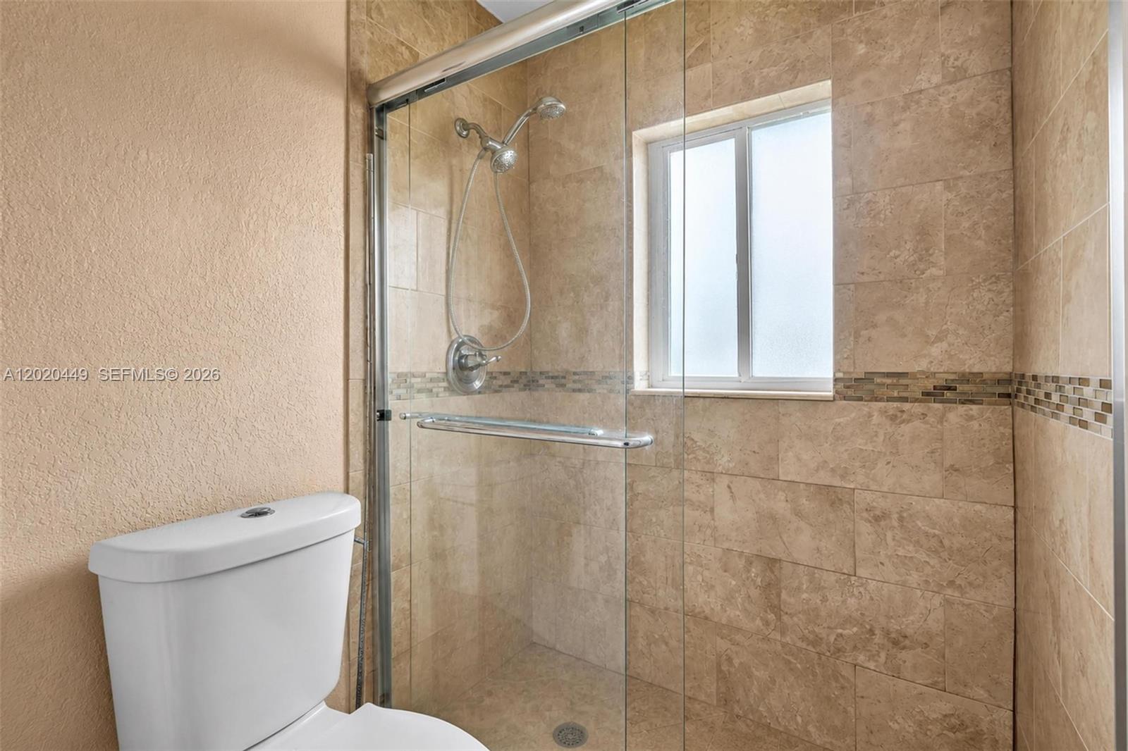 11061 Southwest 163rd Street Miami, FL 33157 - Photo 20 of 42 a bathroom with a toilet and a shower