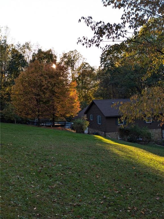 162 Tent Church Road Uniontown, PA 15401 - Photo 23 of 27 a view of a big house with a big yard and large trees