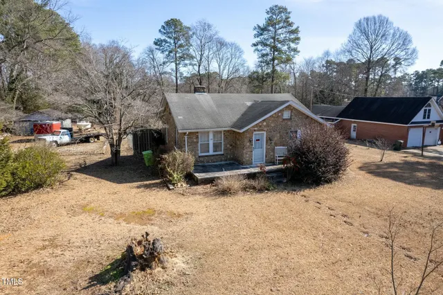 a house with a tree in front of it