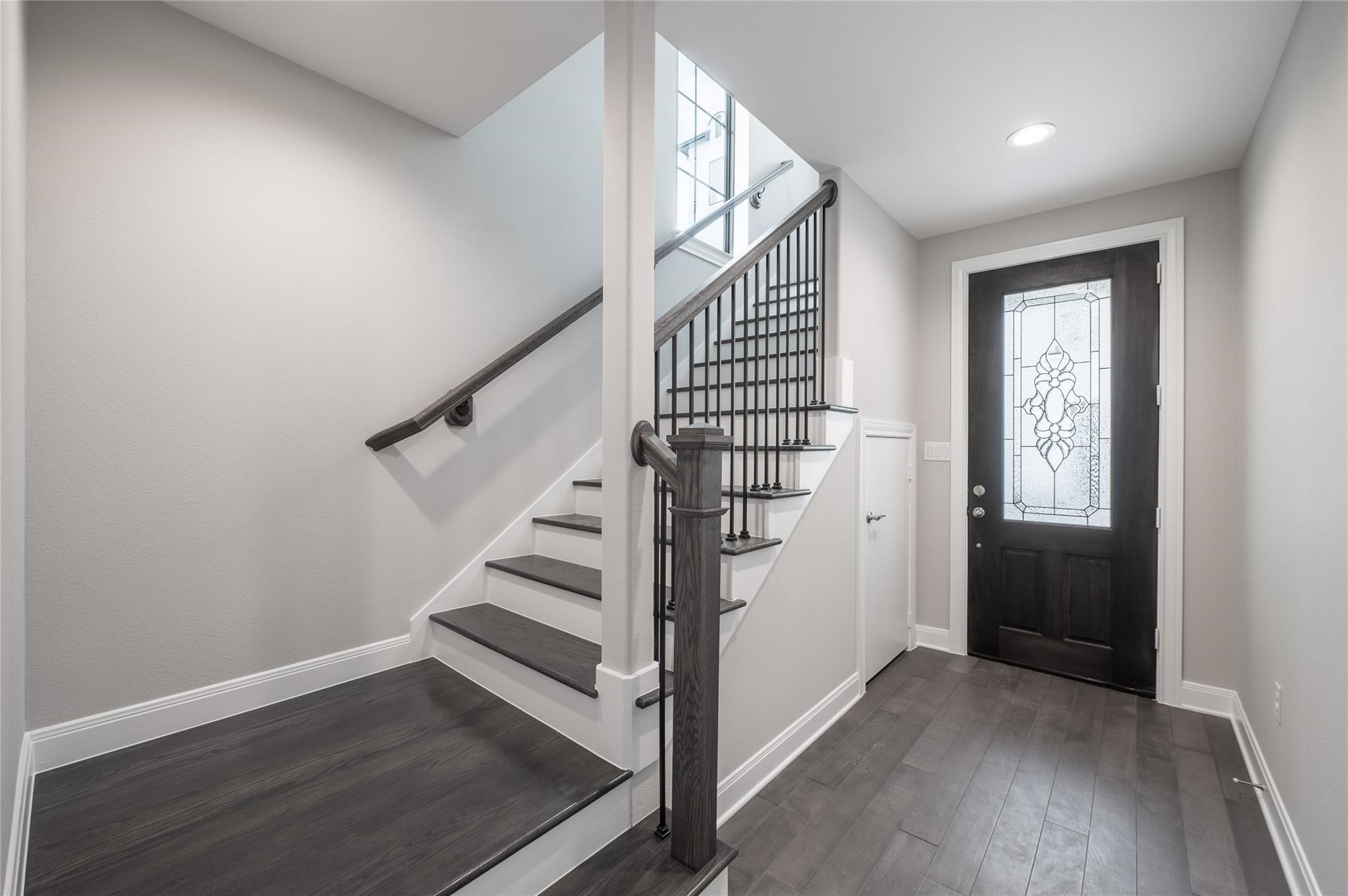 3327 Beverly Forest Drive Houston, TX 77057 - Photo 2 of 12 a view of entryway with wooden floor and stairs