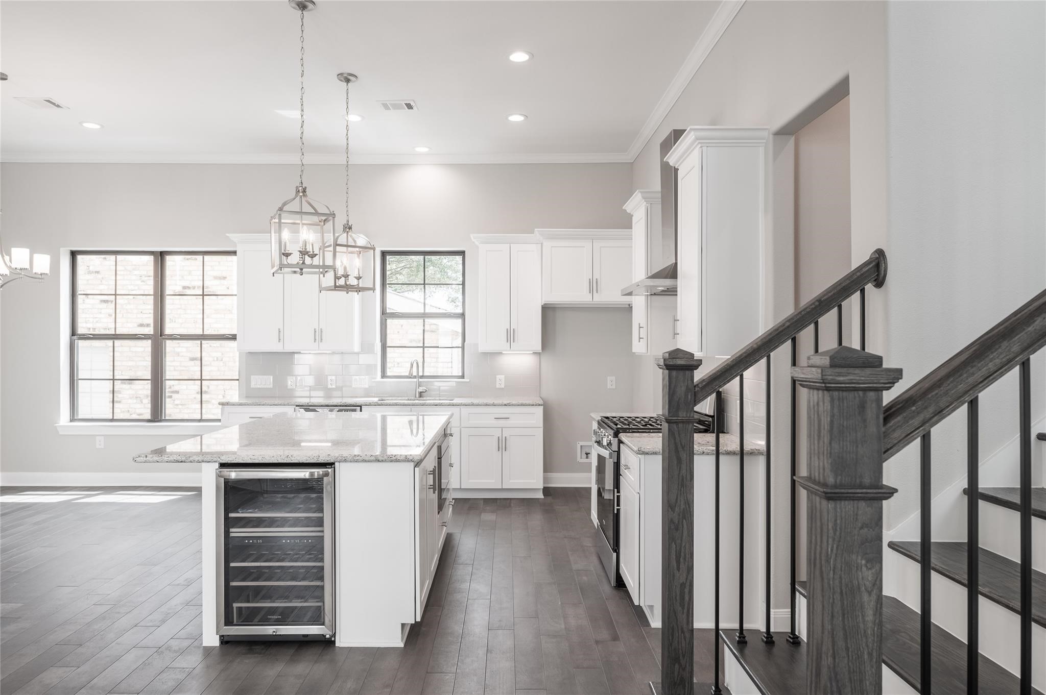 3327 Beverly Forest Drive Houston, TX 77057 - Photo 4 of 12 a kitchen with refrigerator cabinets and wooden floor
