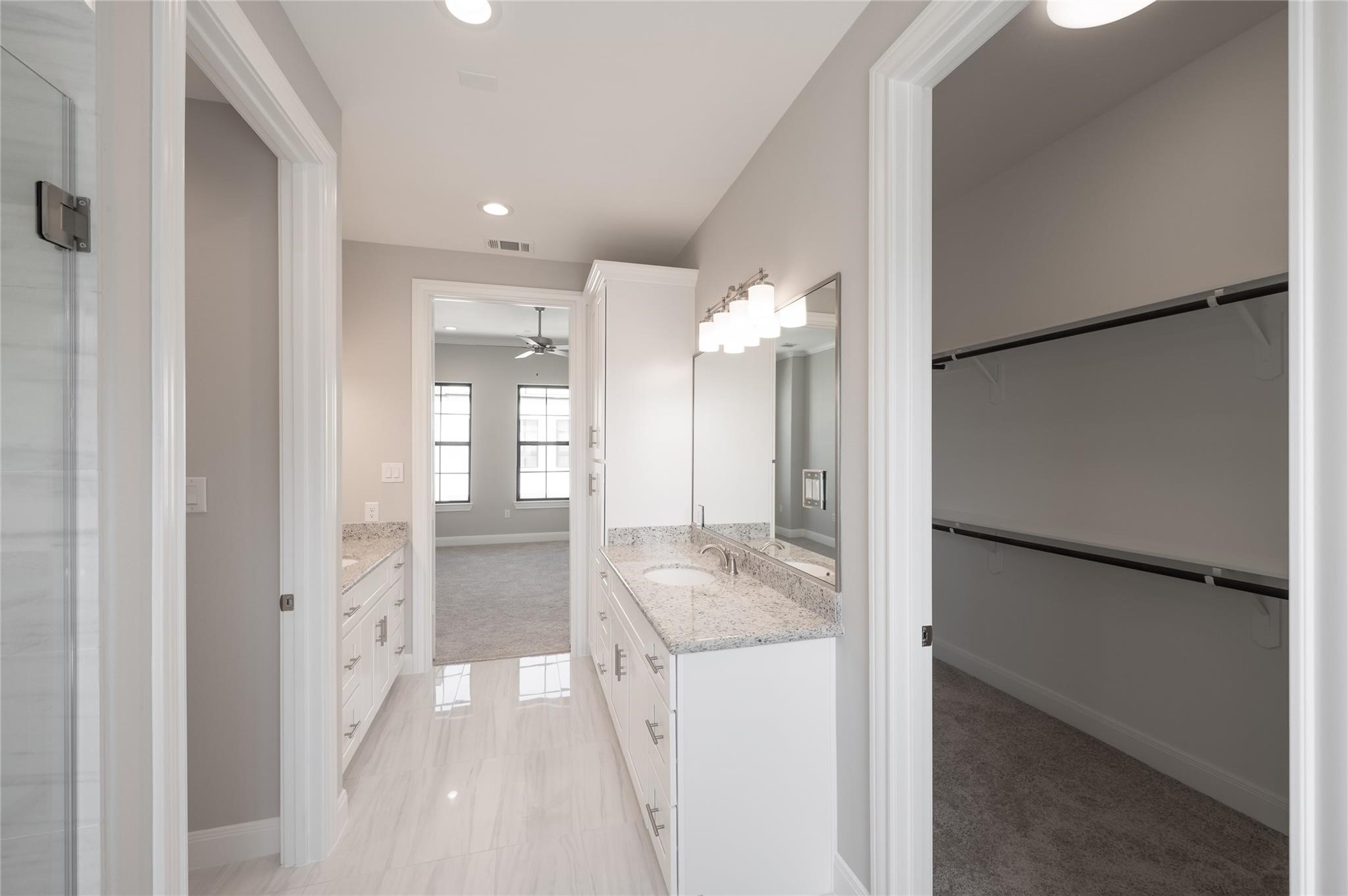 3327 Beverly Forest Drive Houston, TX 77057 - Photo 7 of 12 a bathroom with a granite countertop sink and a mirror