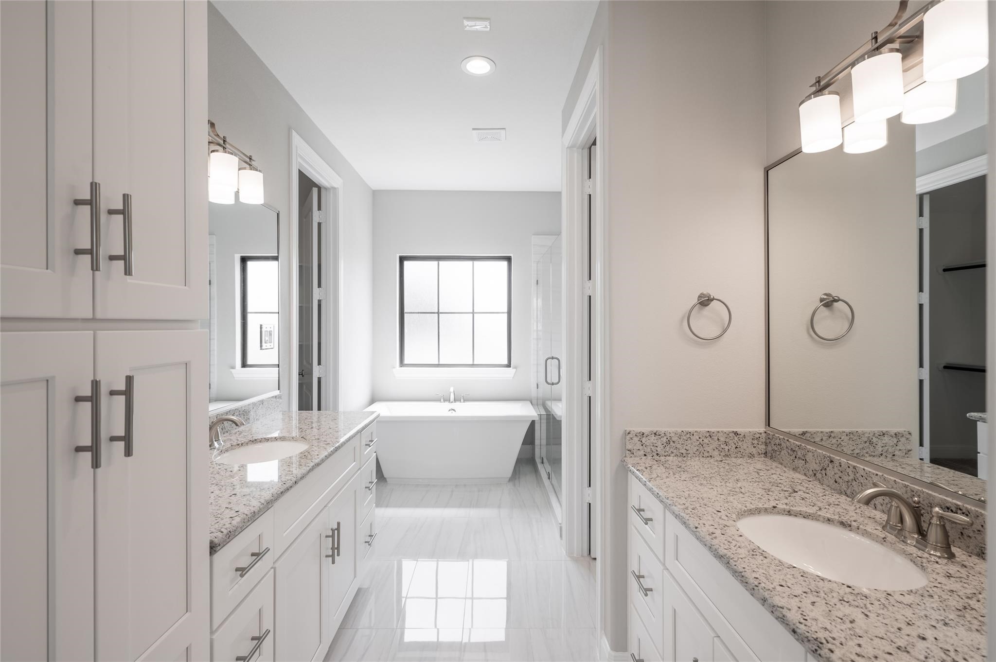 3327 Beverly Forest Drive Houston, TX 77057 - Photo 8 of 12 a spacious bathroom with a granite countertop tub sink and mirror
