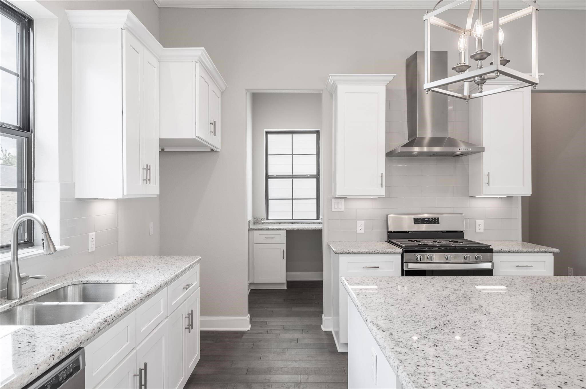 3327 Beverly Forest Drive Houston, TX 77057 - Photo 10 of 12 a kitchen with granite countertop a sink stove and cabinets