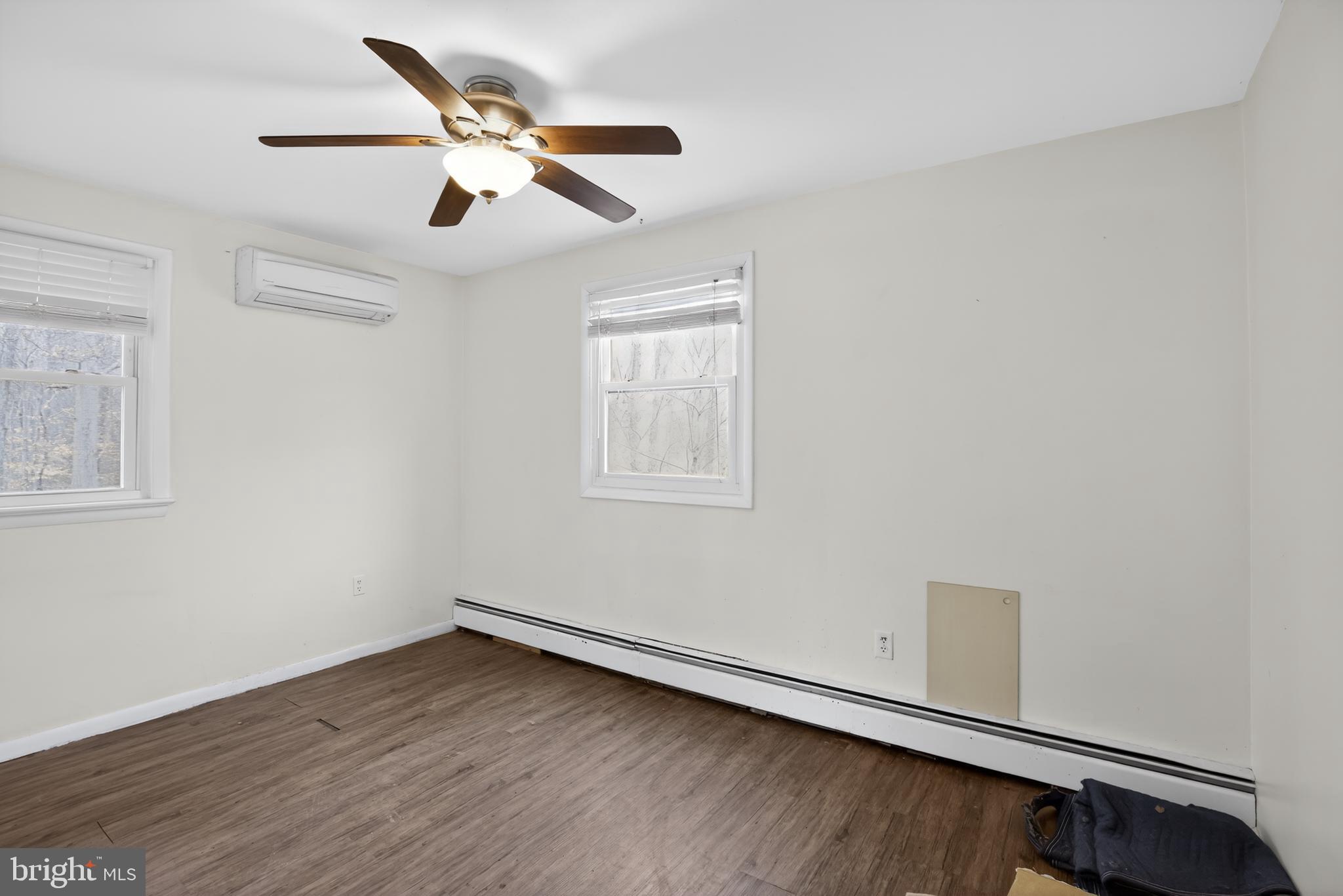 4144 Fox Trail Road Havre de Grace, MD 21078 - Photo 16 of 39 a view of an empty room with wooden floor and a window