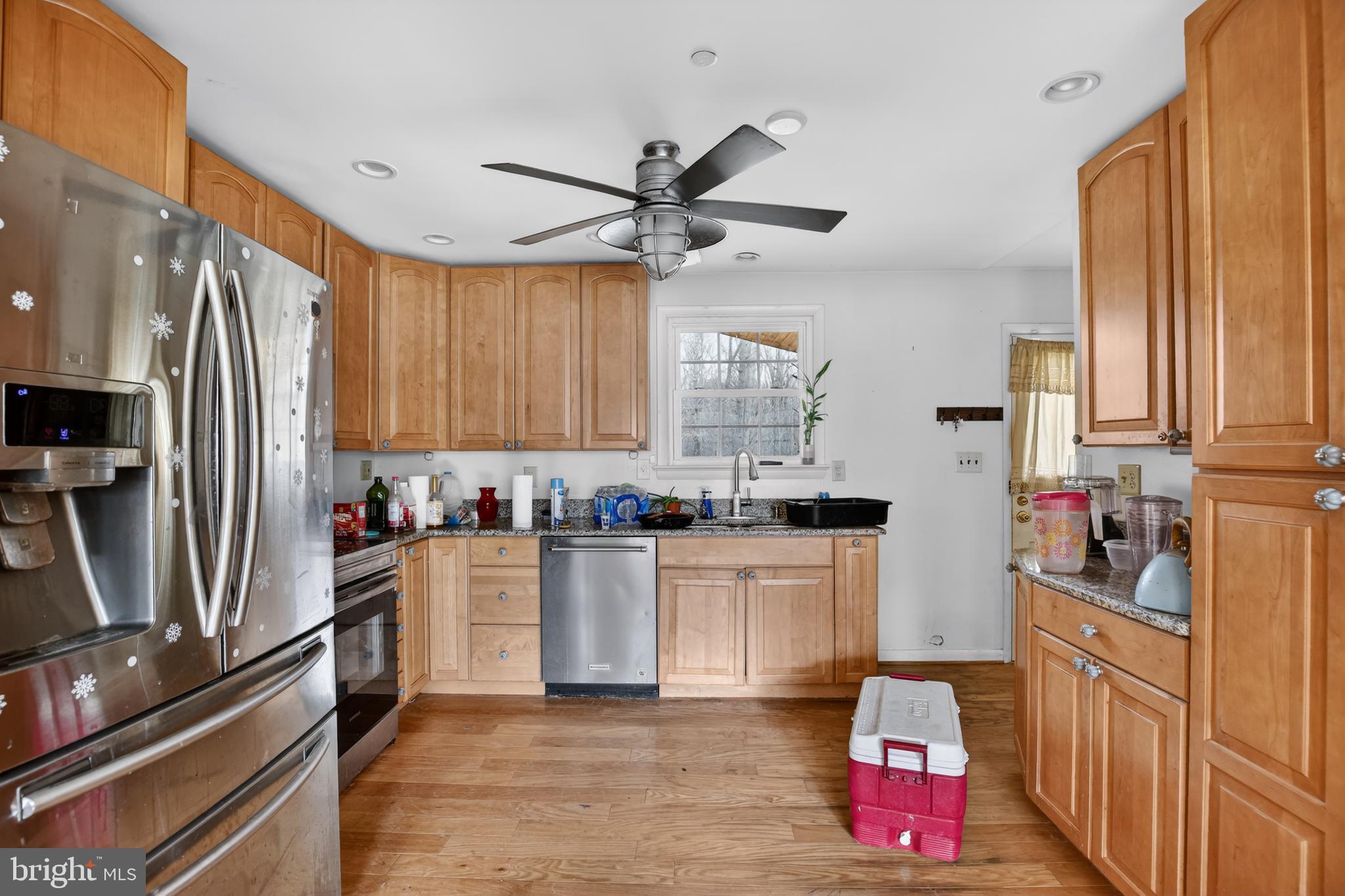 4144 Fox Trail Road Havre de Grace, MD 21078 - Photo 18 of 39 a kitchen with granite countertop a refrigerator stove top oven and sink