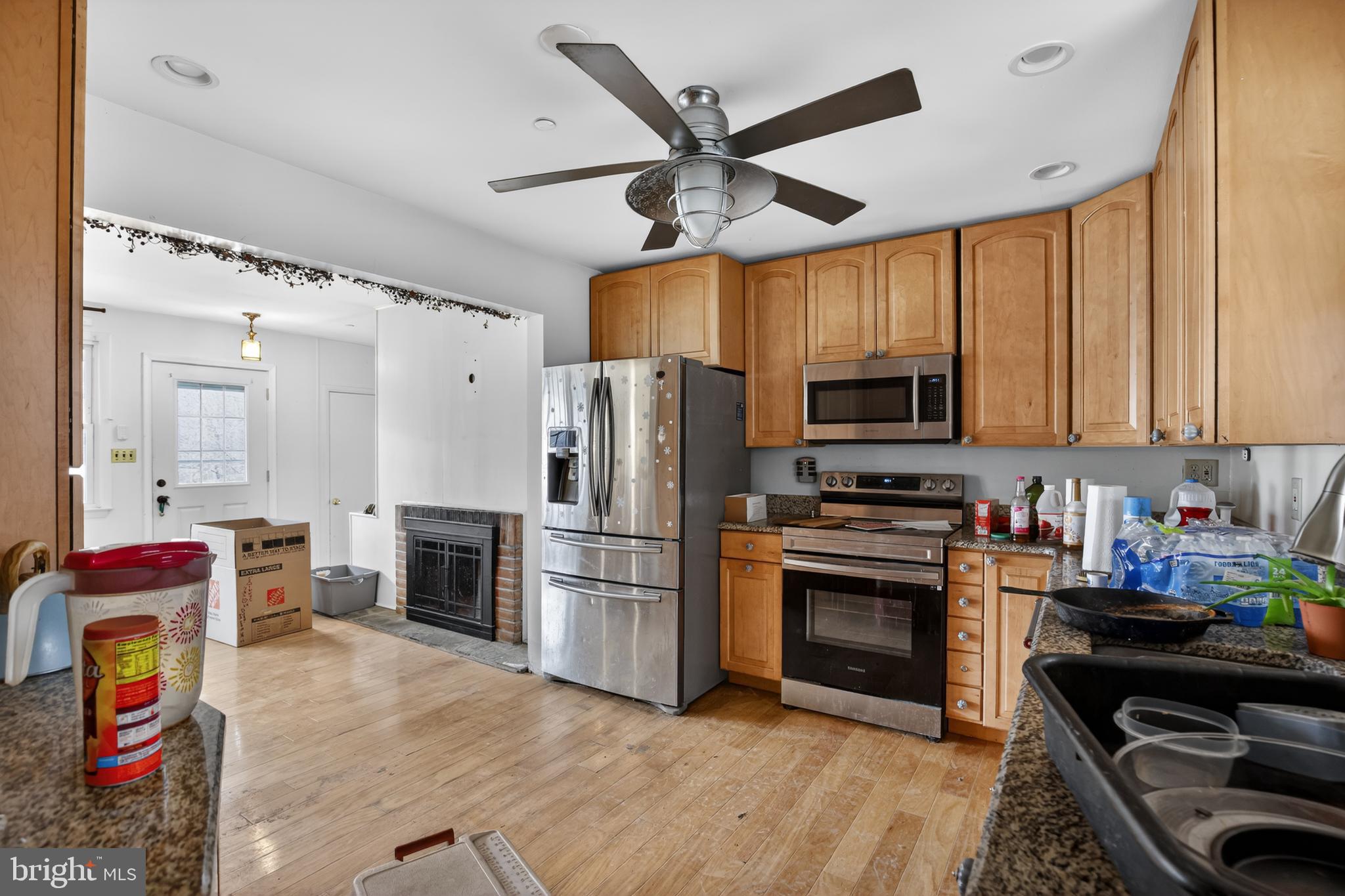 4144 Fox Trail Road Havre de Grace, MD 21078 - Photo 19 of 39 a kitchen with granite countertop a refrigerator stove and microwave