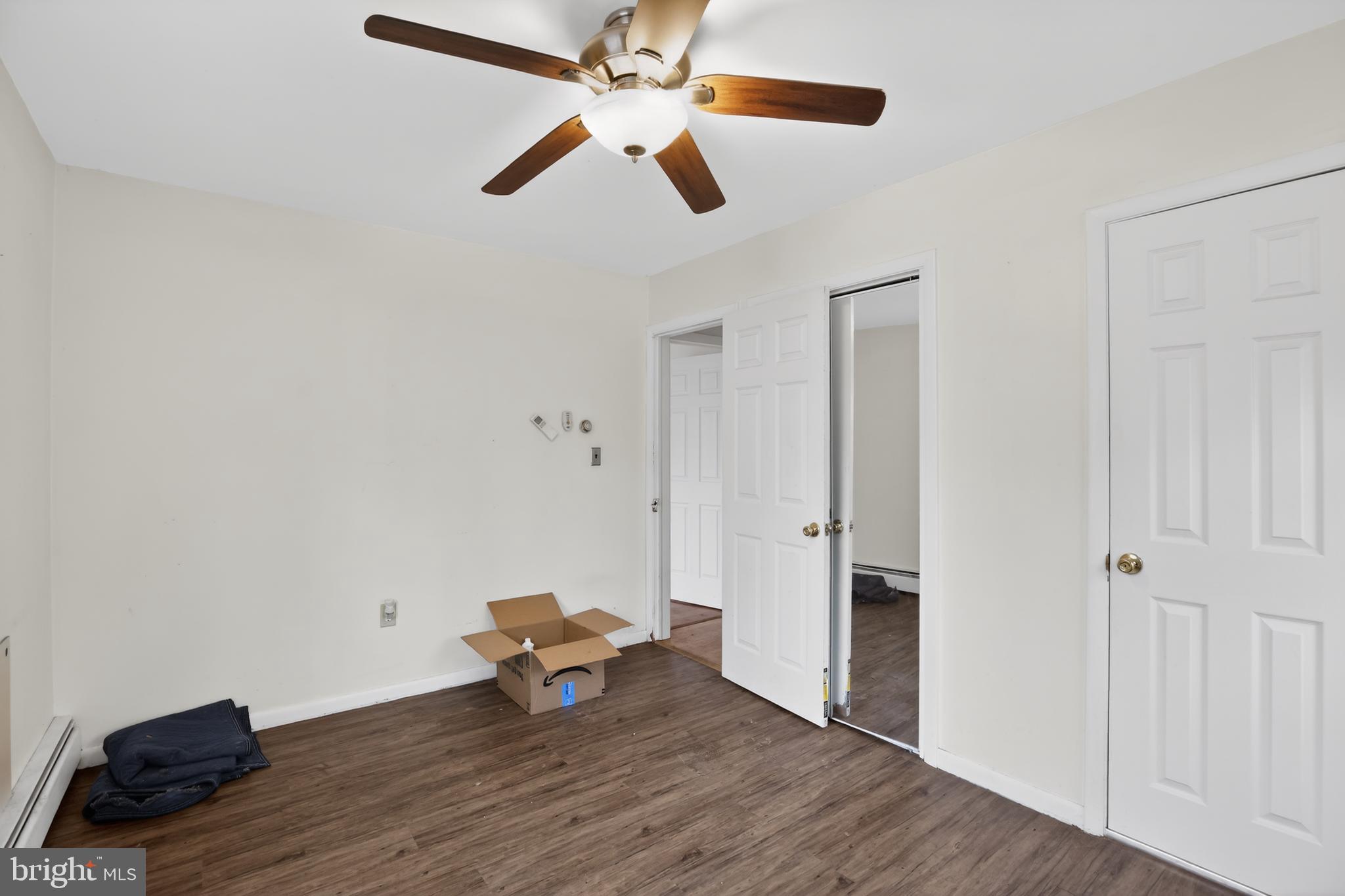 4144 Fox Trail Road Havre de Grace, MD 21078 - Photo 30 of 39 an empty room with wooden floor a ceiling fan and closet