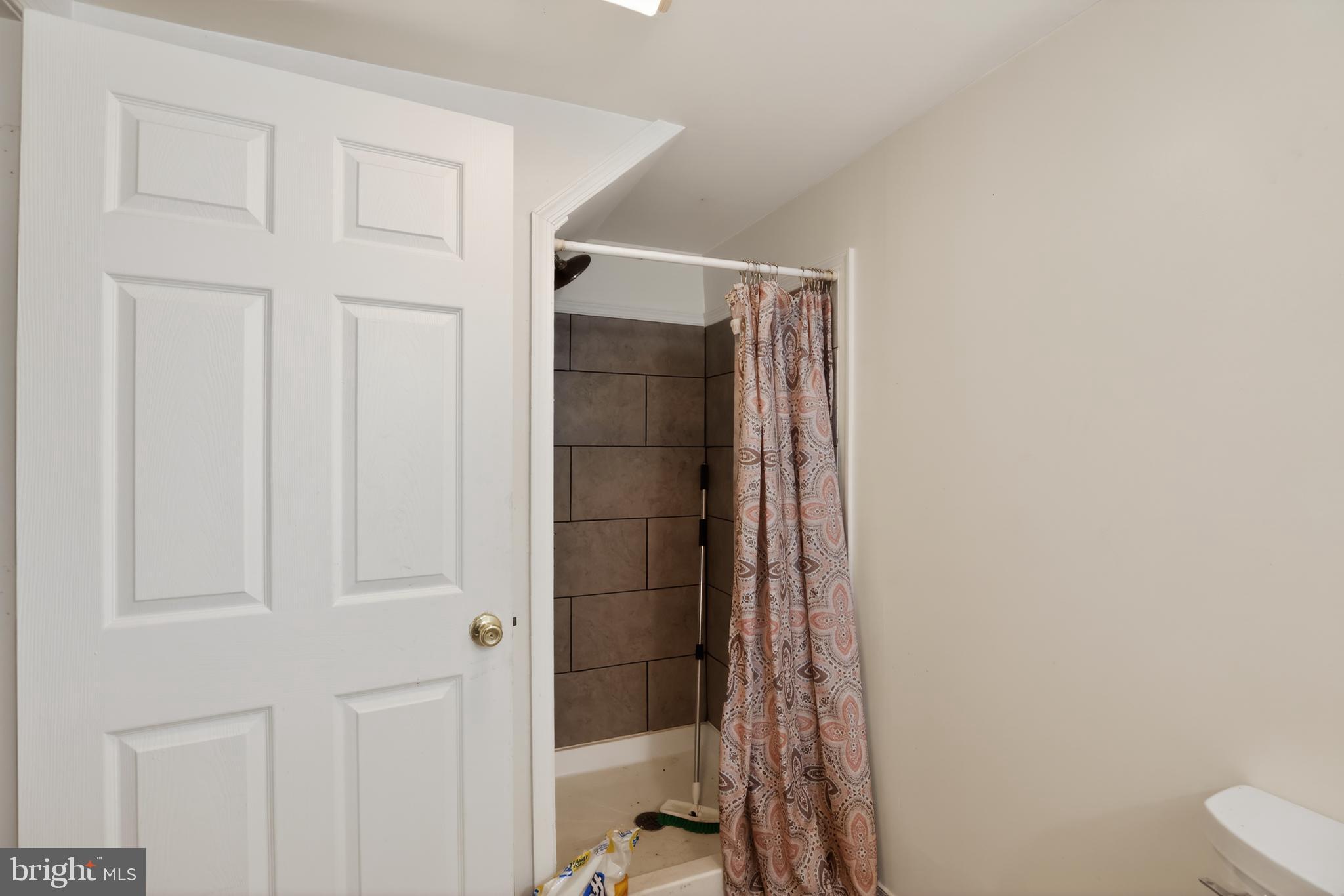 4144 Fox Trail Road Havre de Grace, MD 21078 - Photo 31 of 39 a bathroom with a shower and a toilet
